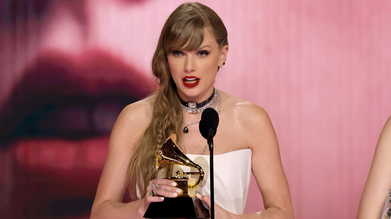 Taylor Swift accepting an award at the 2024 Grammys