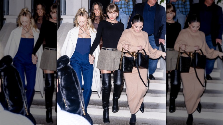 Taylor Swift in a gray skirt and black shirt with Selena Gomez and Brittany Mahomes outside