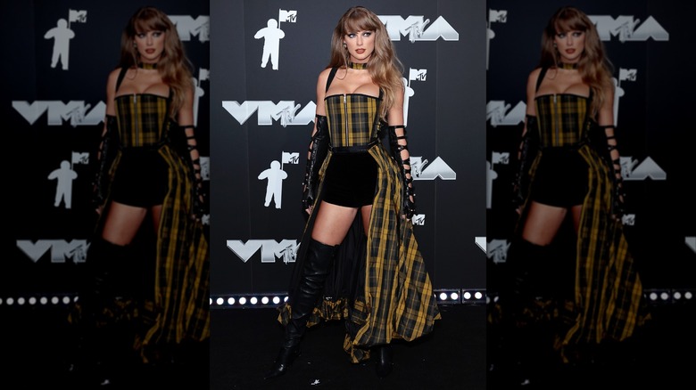 Taylor Swift in a yellow plaid outfit at the 2024 MTV Awards
