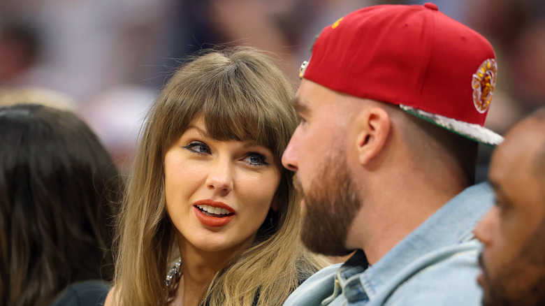 Taylor Swift smiling at Travis Kelce