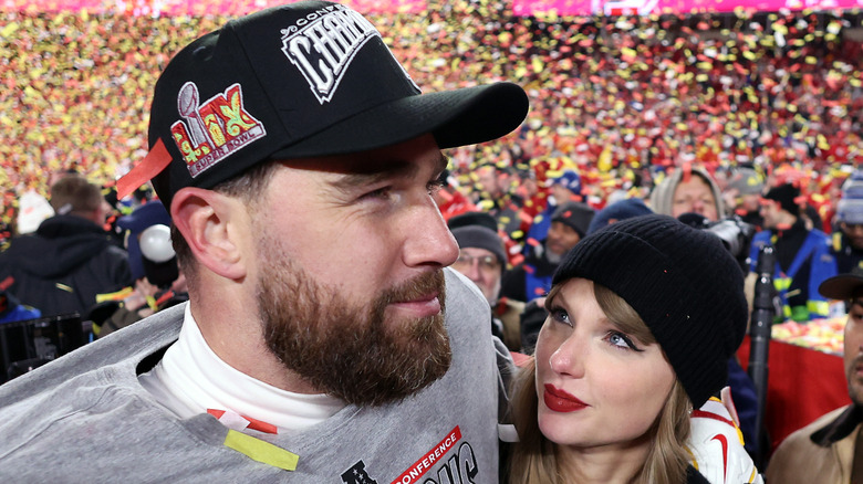 Taylor Swift smiling at Travis Kelce