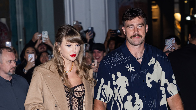 Taylor Swift and Travis Kelce walking together