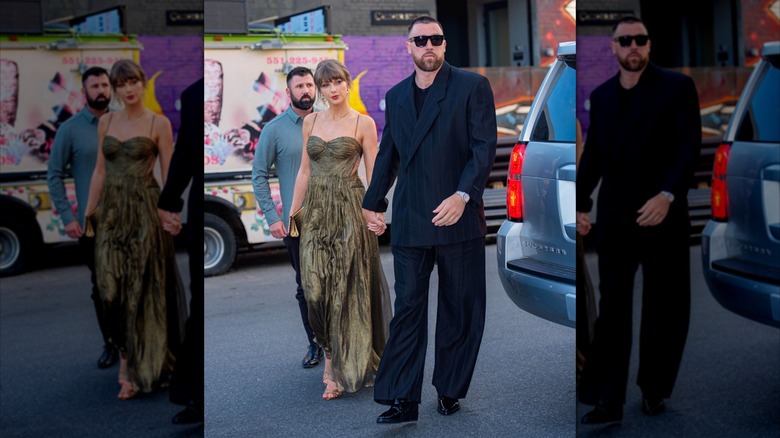 Taylor Swift and Travis Kelce walk together