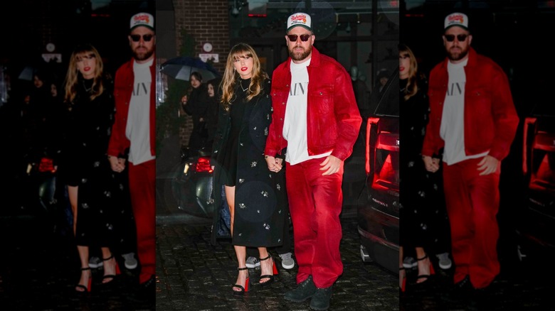Taylor Swift and Travis Kelce holding hands together