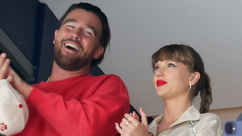 Travis Kelce and Taylor Swift laughing together