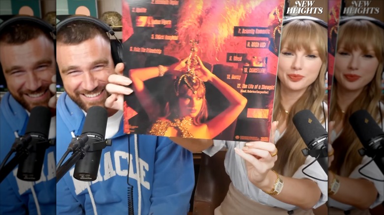 Taylor Swift showing off The Life of a Showgirl album on the New Heights podcast