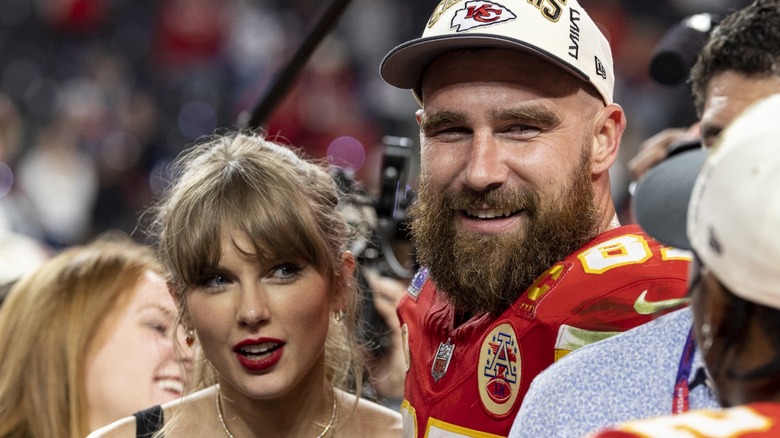 Taylor Swift Travis Kelce looking sideways