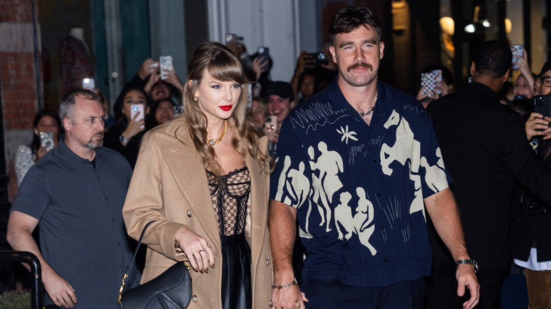 Travis Kelce and Taylor Swift walking