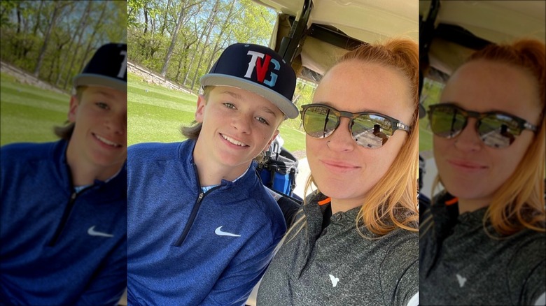Maci Bookout and Bentley Edwards on a golf cart