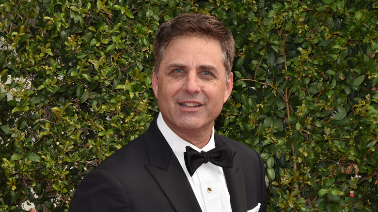 Mark L. Walberg posing in 2015