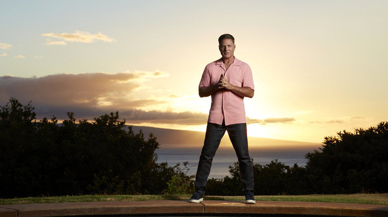 Mark L. Walberg posing in front of sunset
