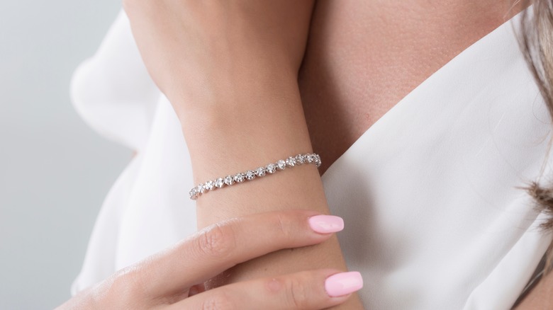 woman wearing traditional tennis bracelet