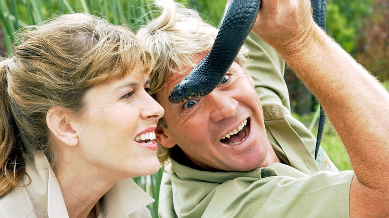Steve Irwin showing Terri Irwin a snake