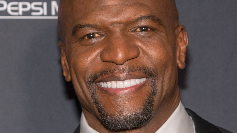 Terry Crews smiling, red carpet 