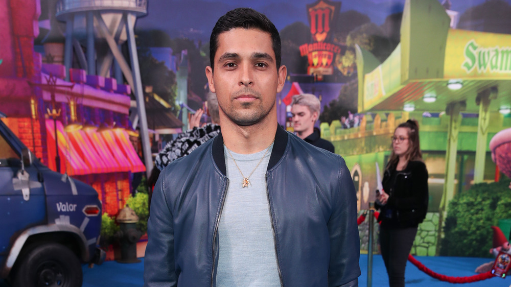 Wilmer Valderama posing in leather jacket