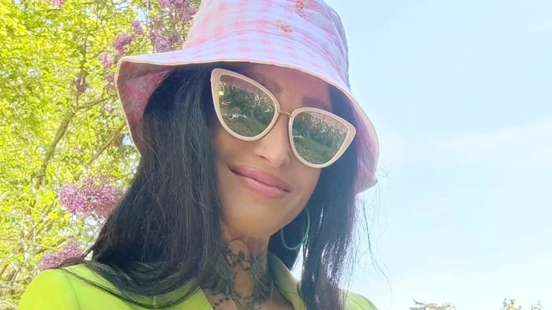 Woman wearing oversized cateye sunglasses