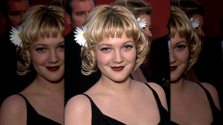 Drew Barrymore smiles with daisies in her hair