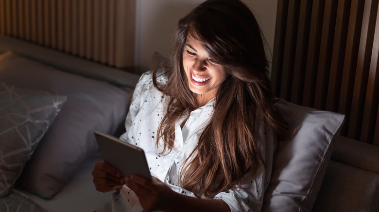 woman reading book e-reader