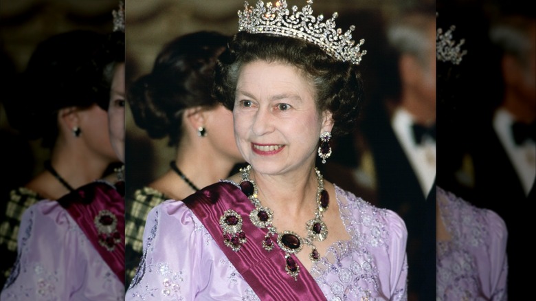Queen Elizabeth smiling and wearing the Kent Amethysts