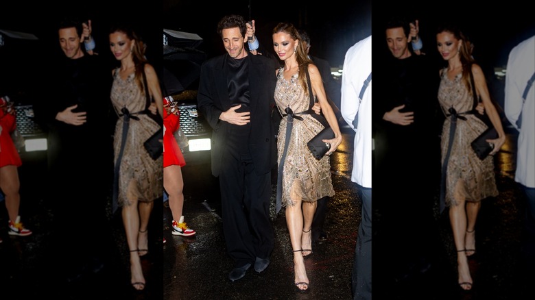 Adrien Brody walking alongside Georgina Chapman
