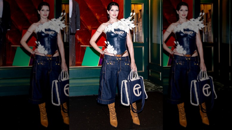 Julia Fox in a blue bustier and culottes