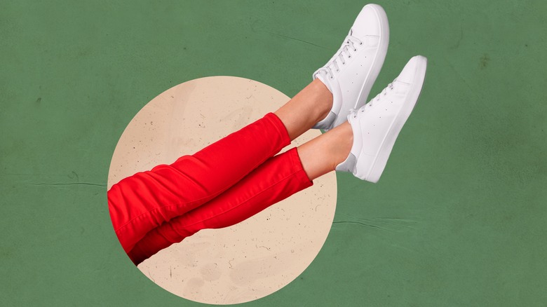 Person wearing red pants and white sneakers