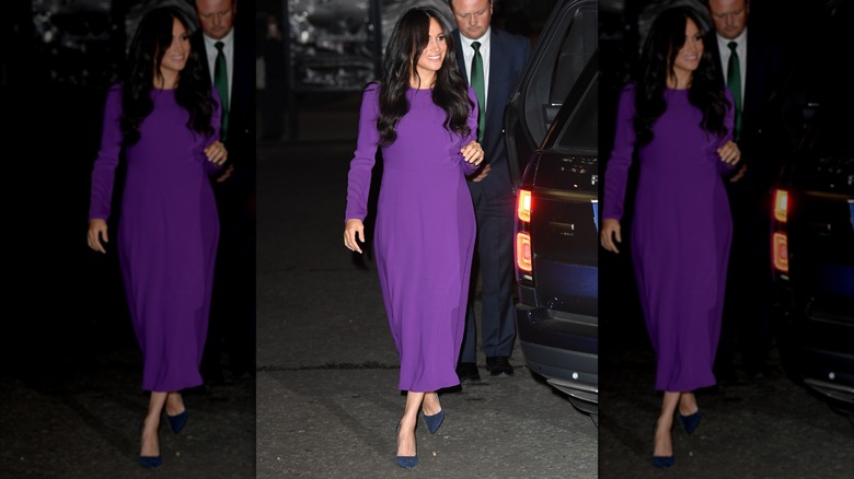 Meghan Markle in a purple dress with blue shoes