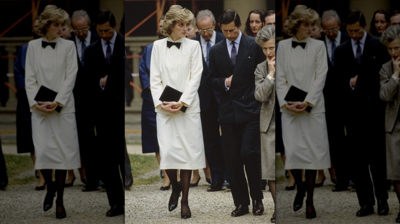 Princess Diana and Prince Charles walking together outside