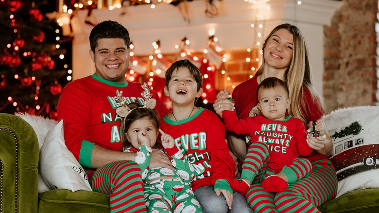 Family in Christmas pyjamas