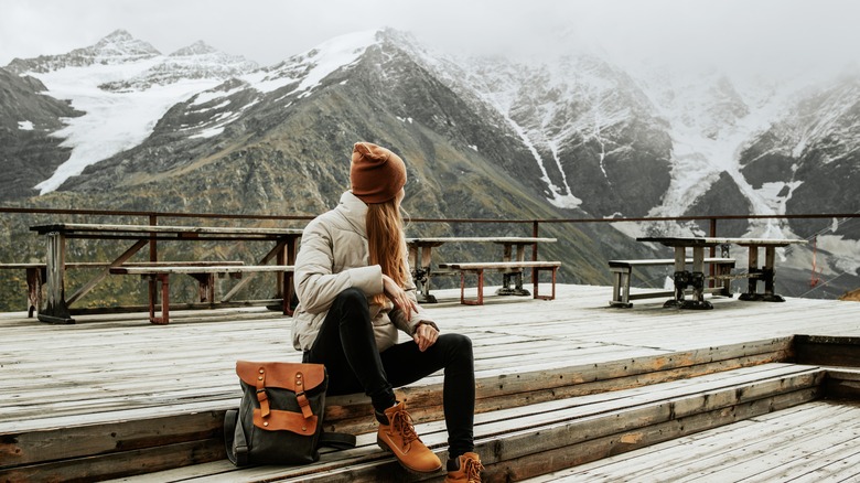 Woman sitting in snowy scenery 
