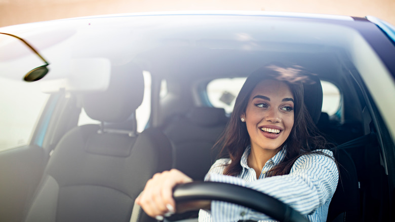 Smiling woman driving