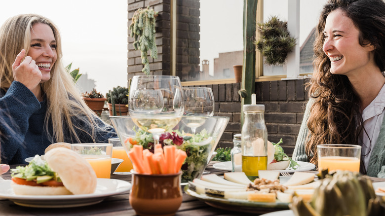 women eating vegetarian at restaurant 