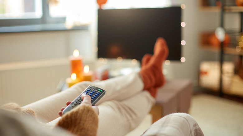 woman watching tv autumn