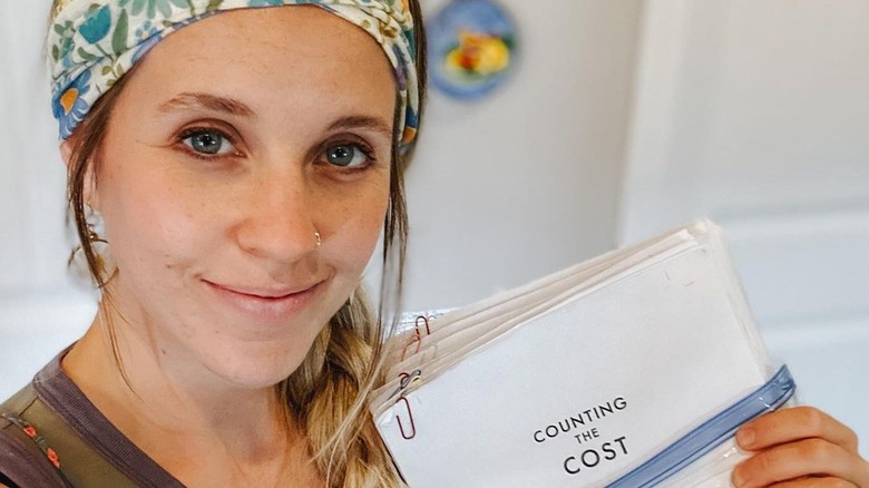 Jill Duggar Dillard with headwrap and manuscript