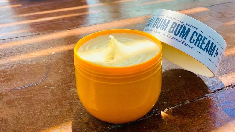 Sol de Janeiro Bum Bum Cream on a wooden table