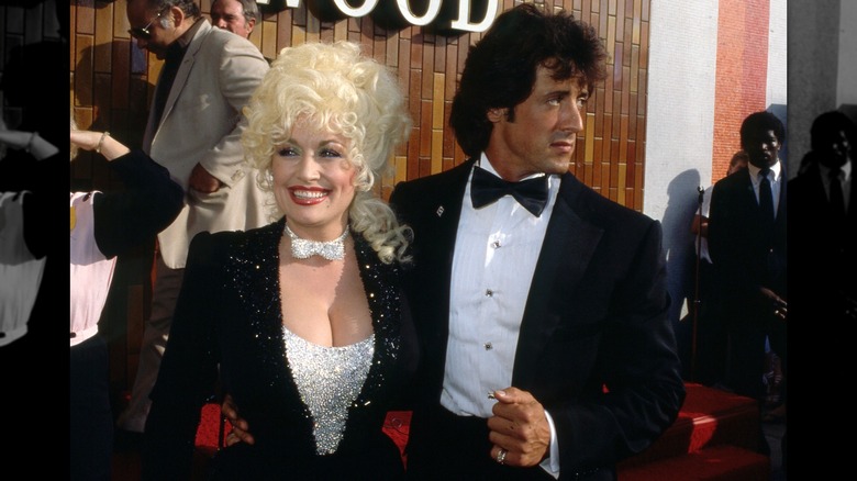 Dolly Parton and Sylvester Stallone posing together in formal wear