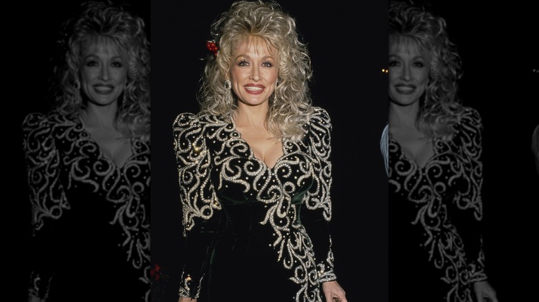 Dolly Parton smiling outside at night