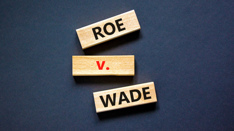 wooden blocks with the words "roe v. wade" written on top 