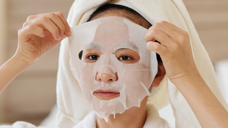 woman wearing sheet mask