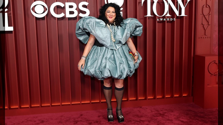 Ashley Longshore posing on the 2025 Tony Awards red carpet