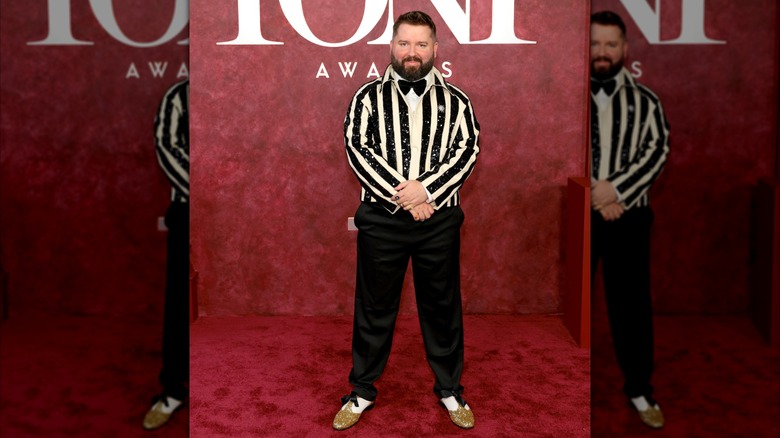 Kip Williams posing on the 2025 Tony Awards red carpet