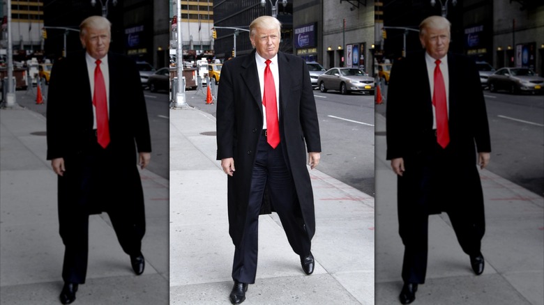 Donald Trump stepping out in a long red tie