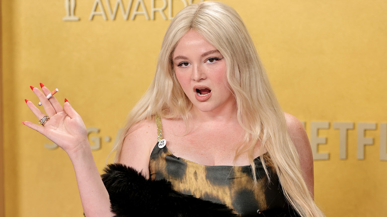 Megan Stalter posing in a leopard dress with a cigarette at the 2026 Actor Awards