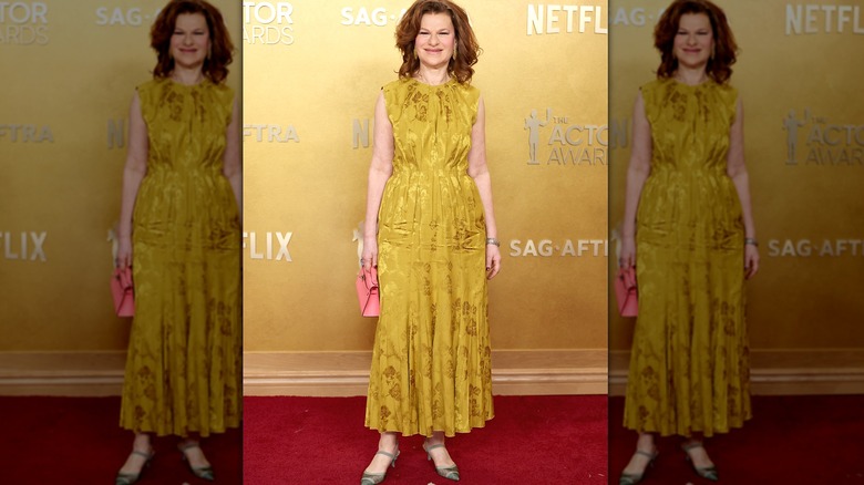Sandra Bernhard posing in yellow brocade at the 2026 Actor Awards
