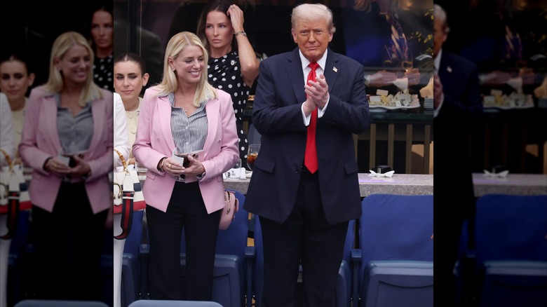 Pam Bondi and Donald Trump clapping at the U.S. Open.