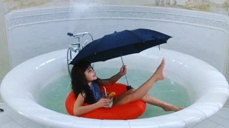 Alisan Porter as a child with umbrella