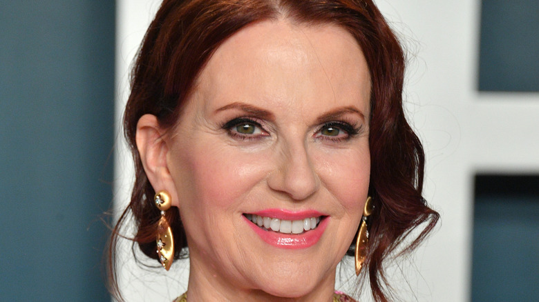 Megan Mullally poses on the red carpet