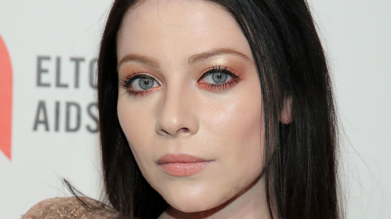 Michelle Trachtenberg poses on the red carpet