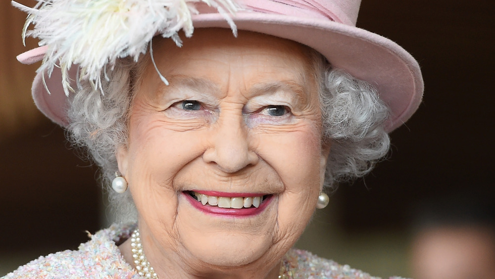 Queen Elizabeth smiles at an event