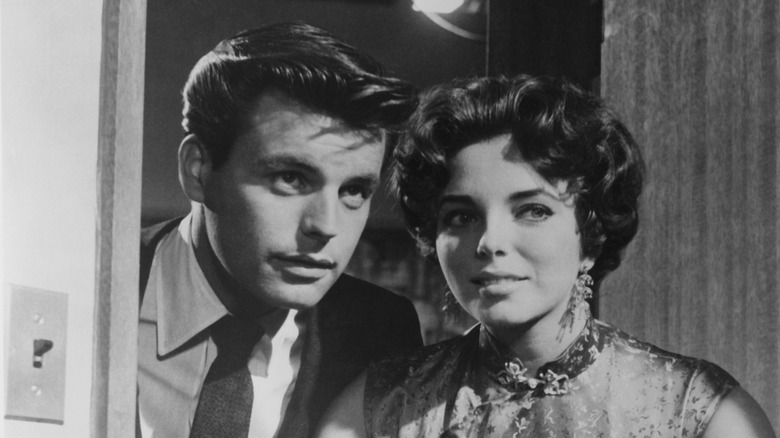 Joan Collins (right) and Robert Wagner (left) in a scene from "Stopover Toyko" (1957)